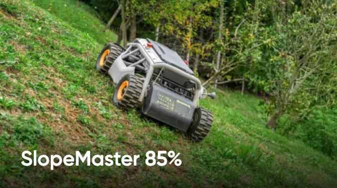 Auf dem Bild ist zu sehen, wie der Rasenmäher selbst an extrem steilen Hängen mit 85 % Gefälle mäht. Auf dem Bild ist zu sehen, wie der Rasenmäher selbst an extrem steilen Hängen mit 85 % Gefälle mäht.